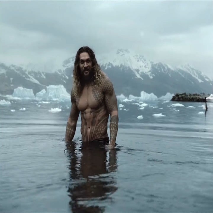 Jason Mamoa as Aquaman, standing in the waters next to Djúpavík