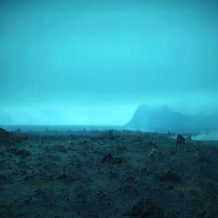 A rocky, barren, and smoking landscape in the video game Death Stranding