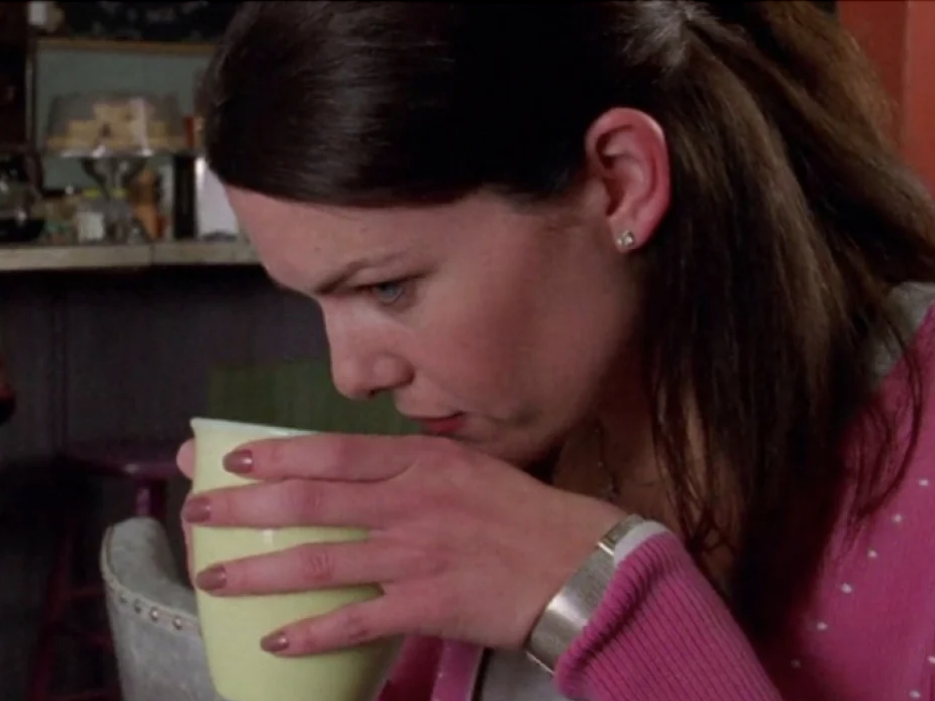 Lorelai drinking coffee