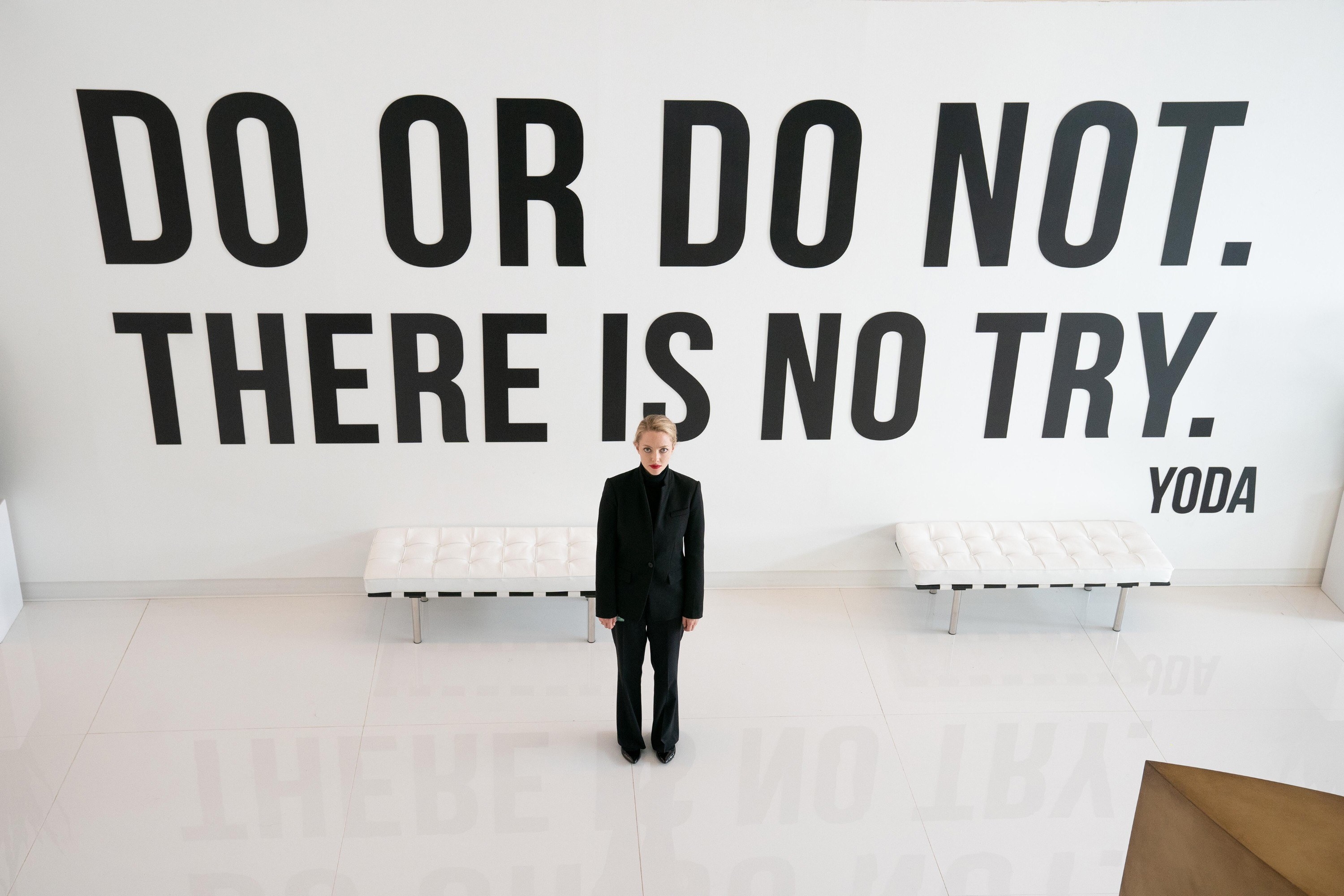Amanda as Elizabeth standing in front of a wall that says &quot;Do or do not, there is no try&quot;