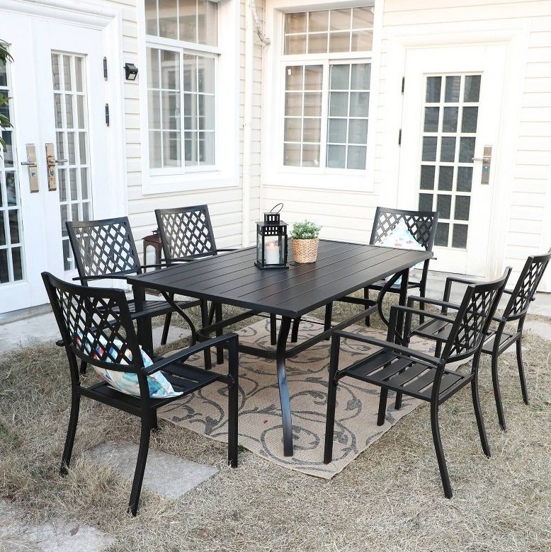 A 7pc outdoor rectangular dining set in black