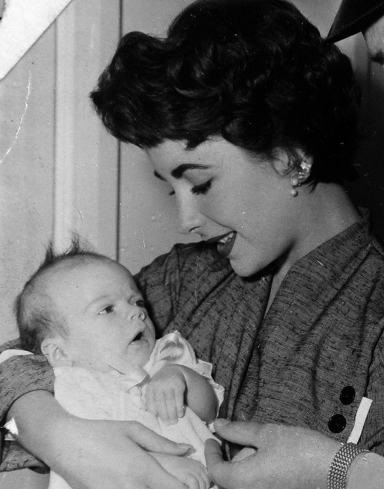 Elizabeth Taylor holding her infant son, &quot;Michael Wilding Jr.&quot;