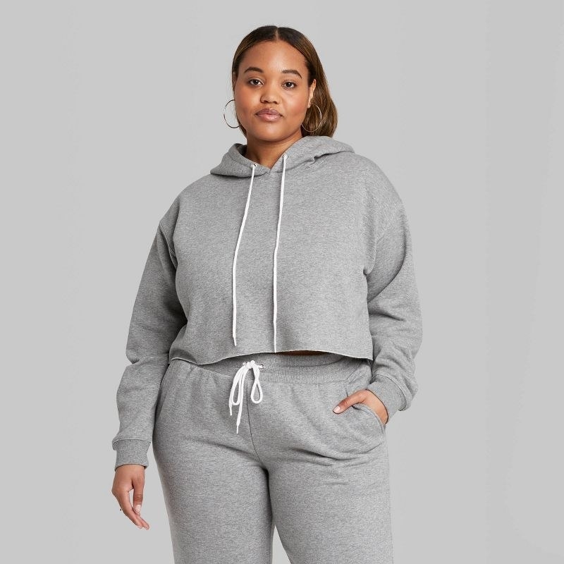 model wearing the hoodie in gray