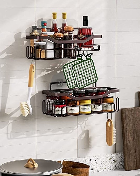 The caddy shelves hung up on a tile wall in a bathroom