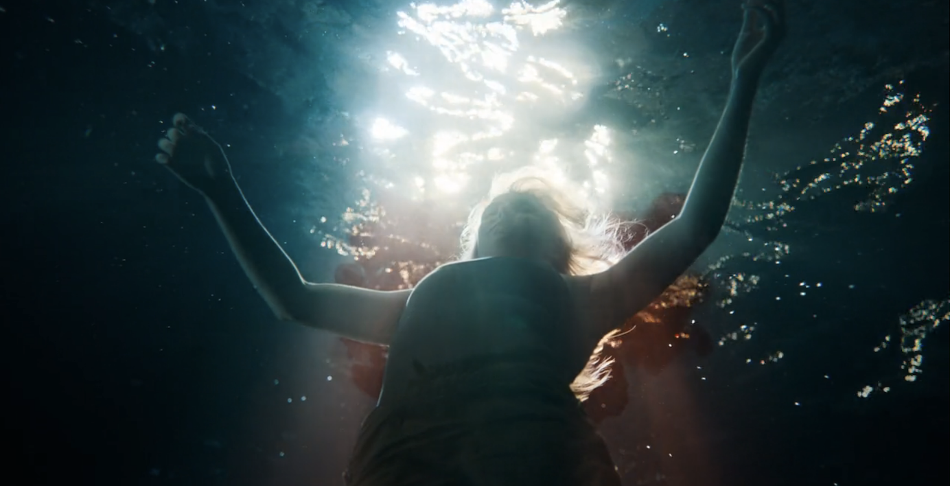 Villanelle in the water, surrounded by blood