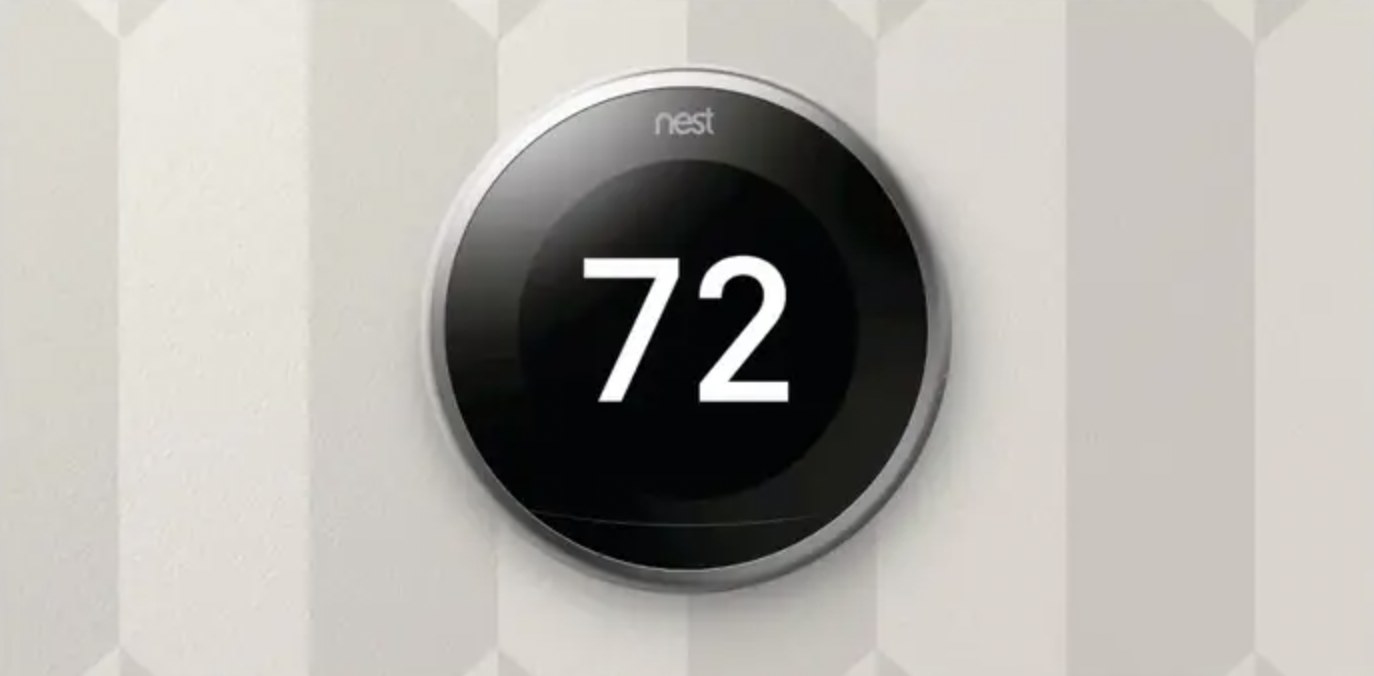 The black thermostat reading 72 degrees
