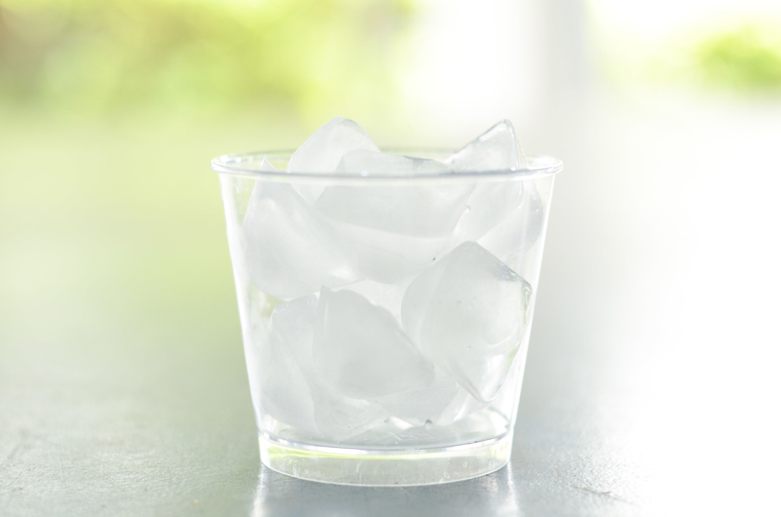 water with crushed ice cubes in glass