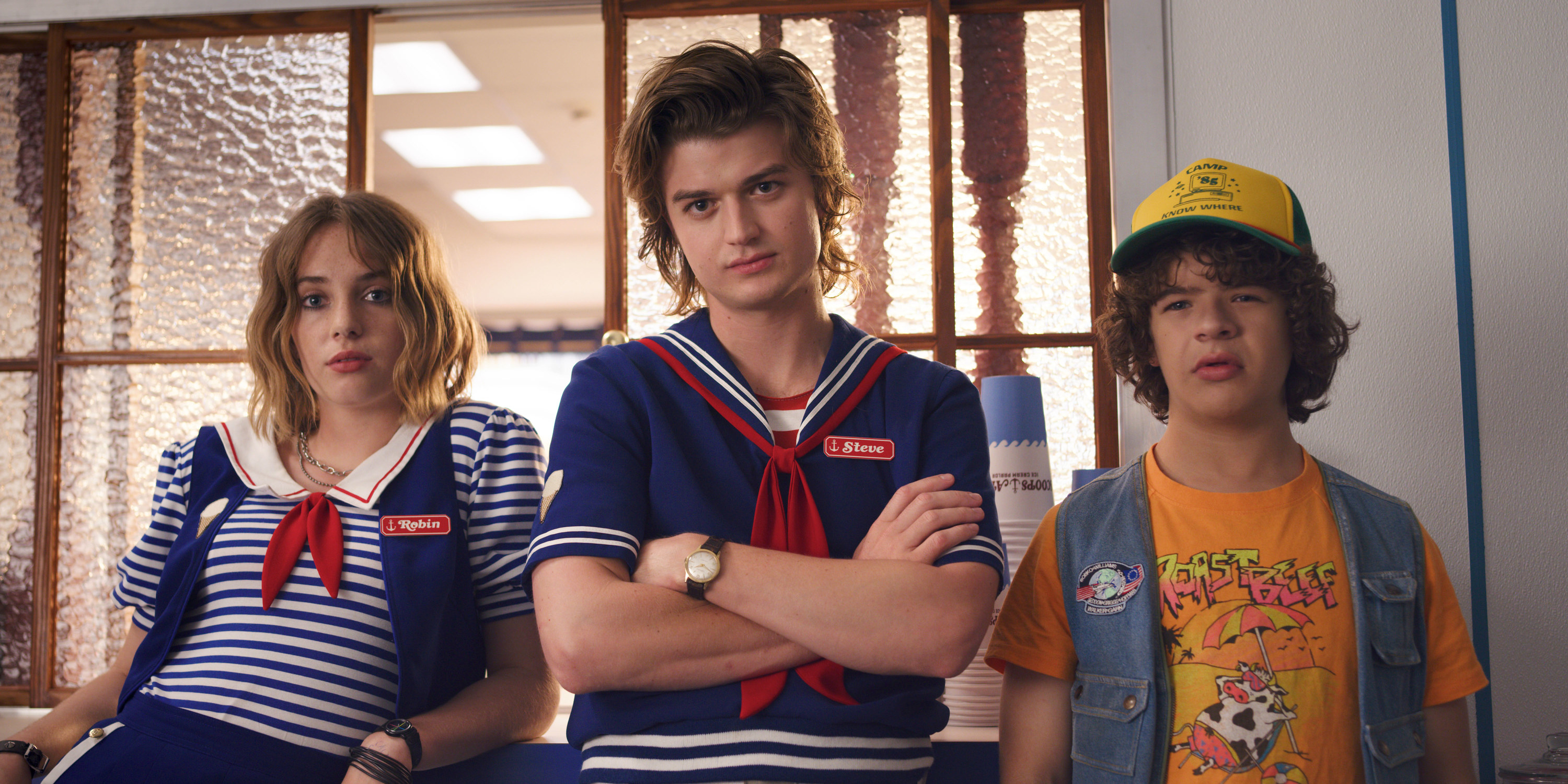 Joe's character Steve wears a sailor uniform while standing next to costars