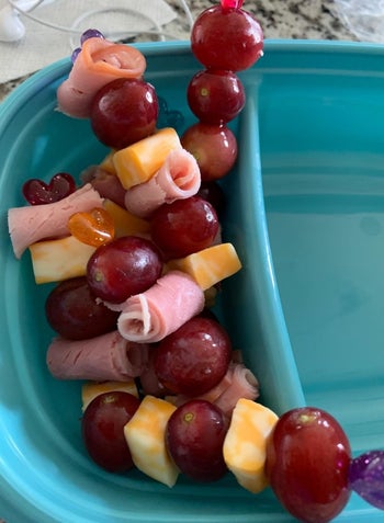 reviewer's photo of kabobs in their child's lunchbox