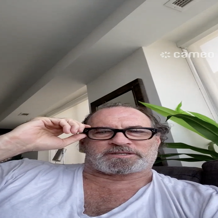 scott adjusting his glasses