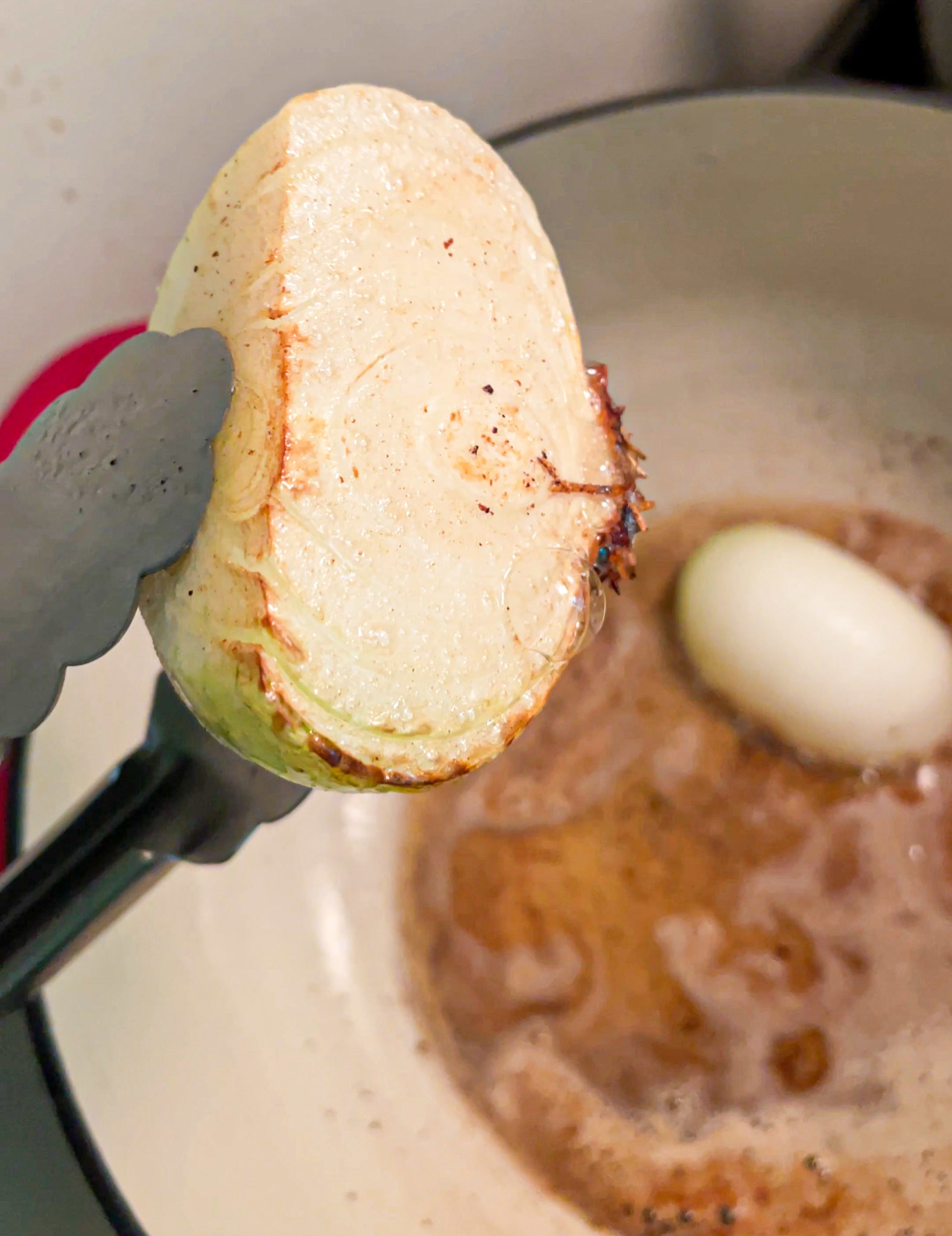 the underside of the onion half, browned