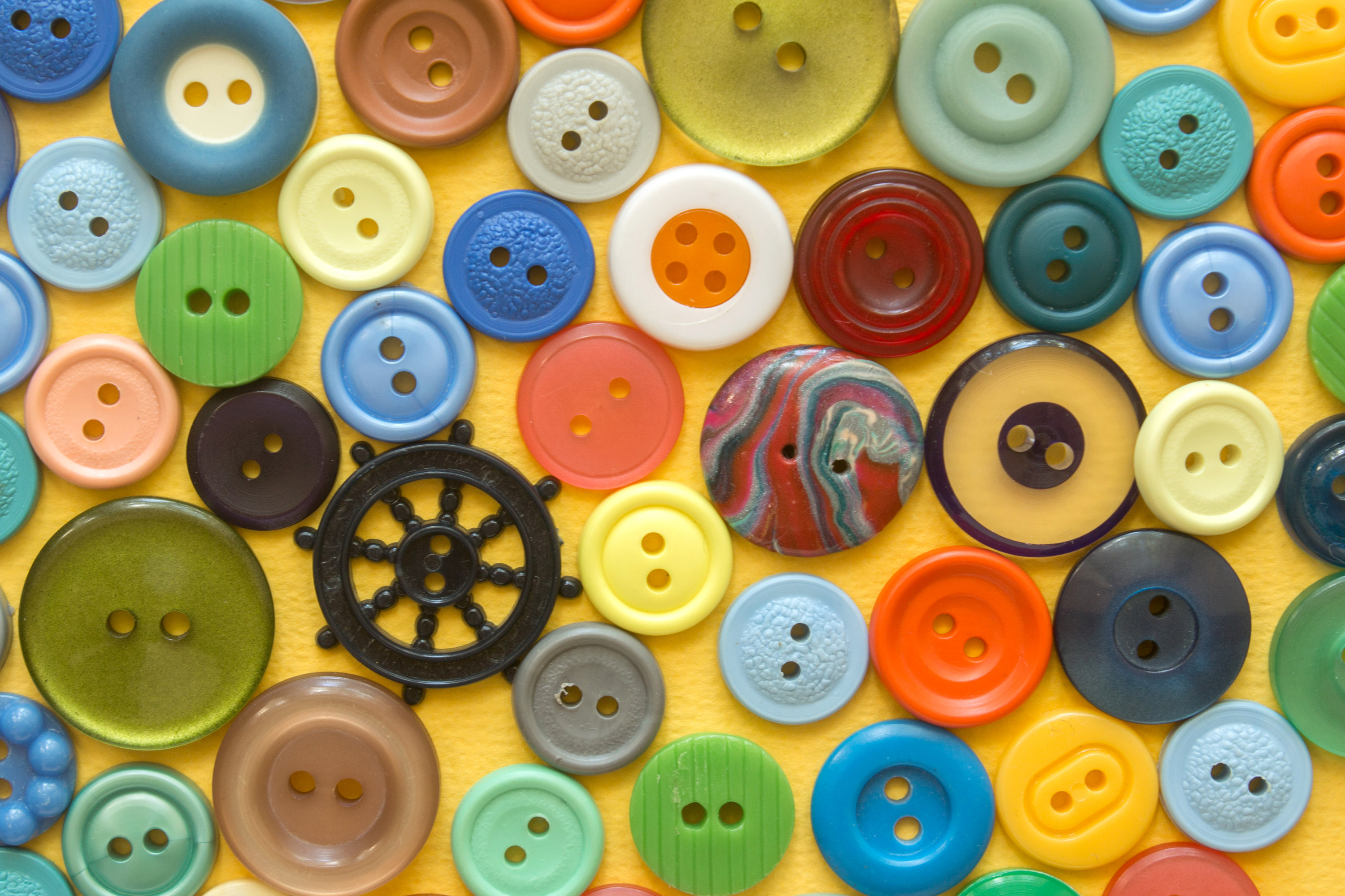 Multicolored buttons on a surface