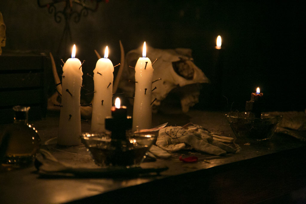 Spell candles lit on a table