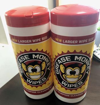 reviewer image of two containers of grease monkey wipes