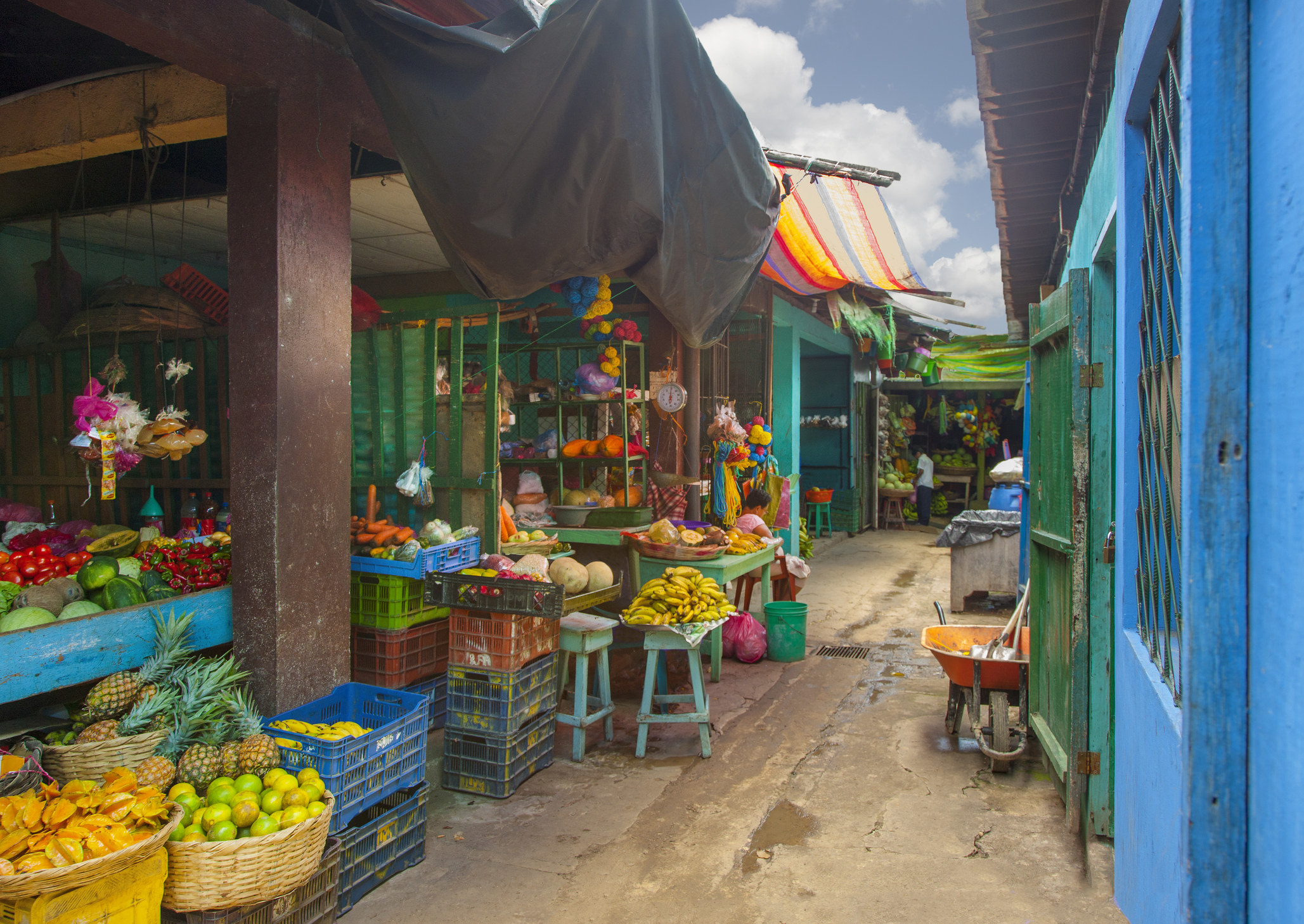A colorful market selling fruit.