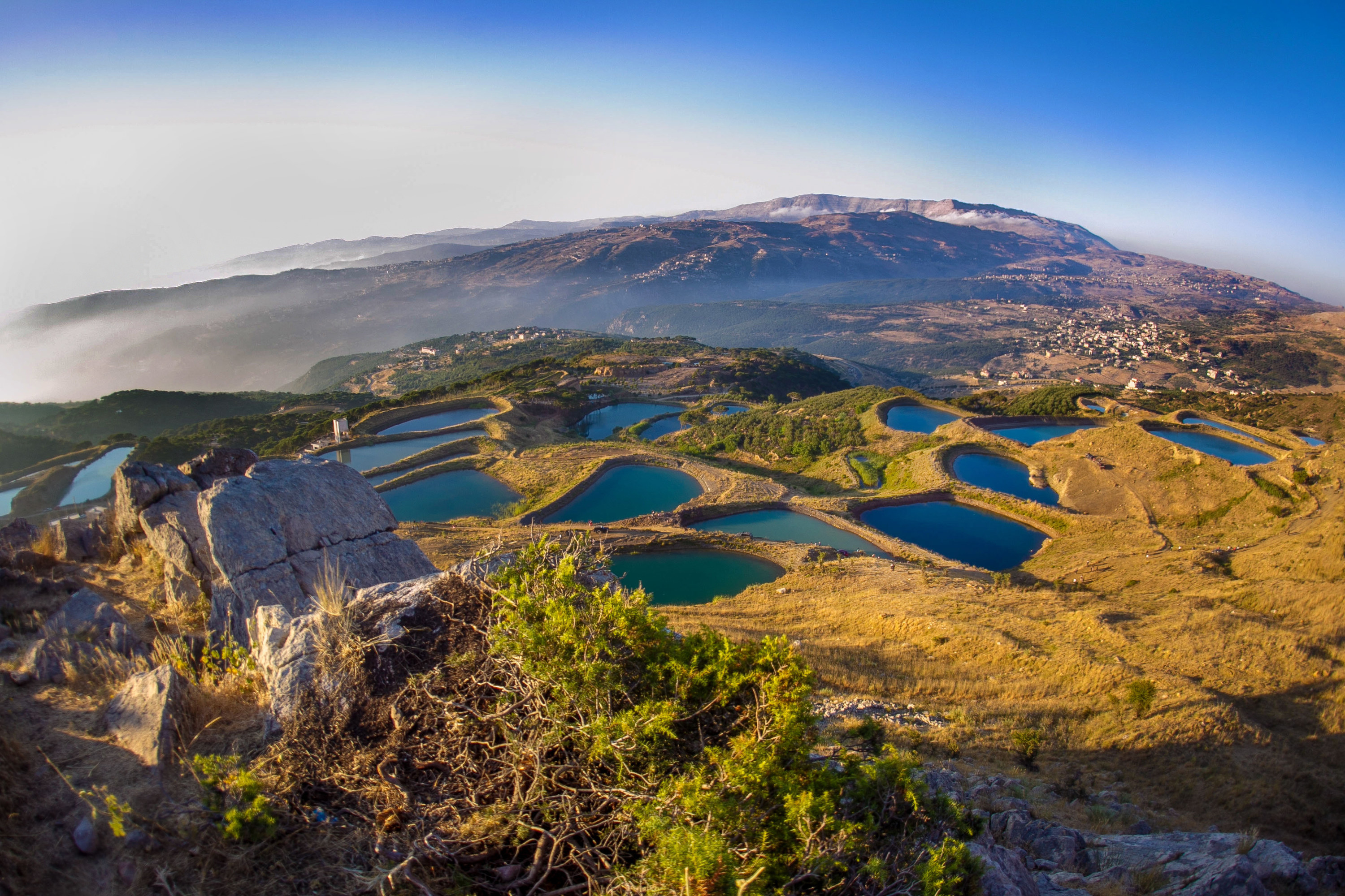 A scenic view of mountains and lakes against the sky in Lebanon.