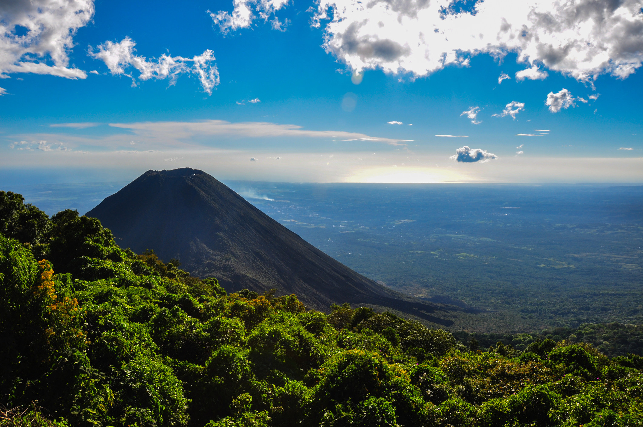 A volcano surrounded by forest in El Salvador.