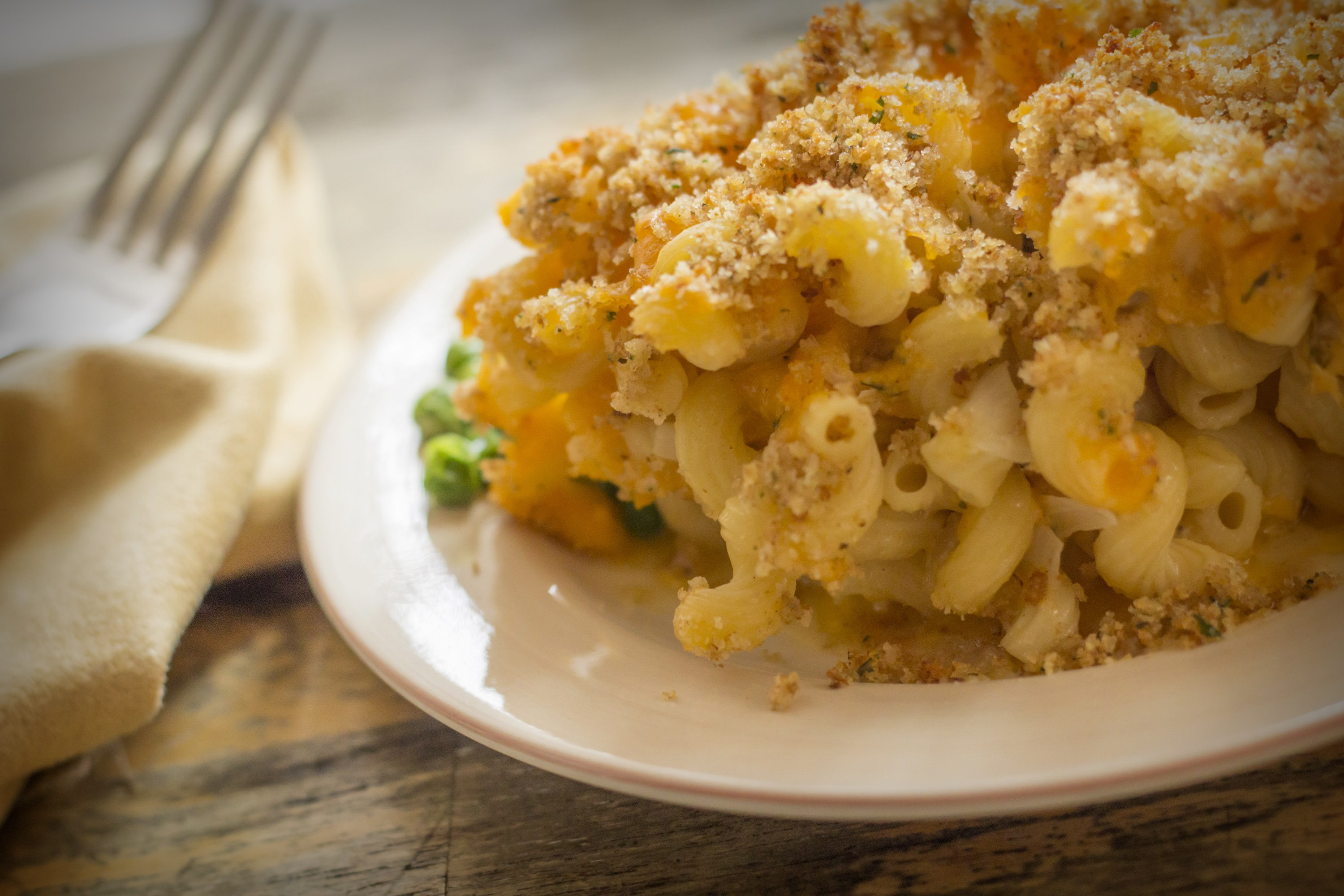 Home made baked macaroni and cheese with crispy breadcrumb topping.