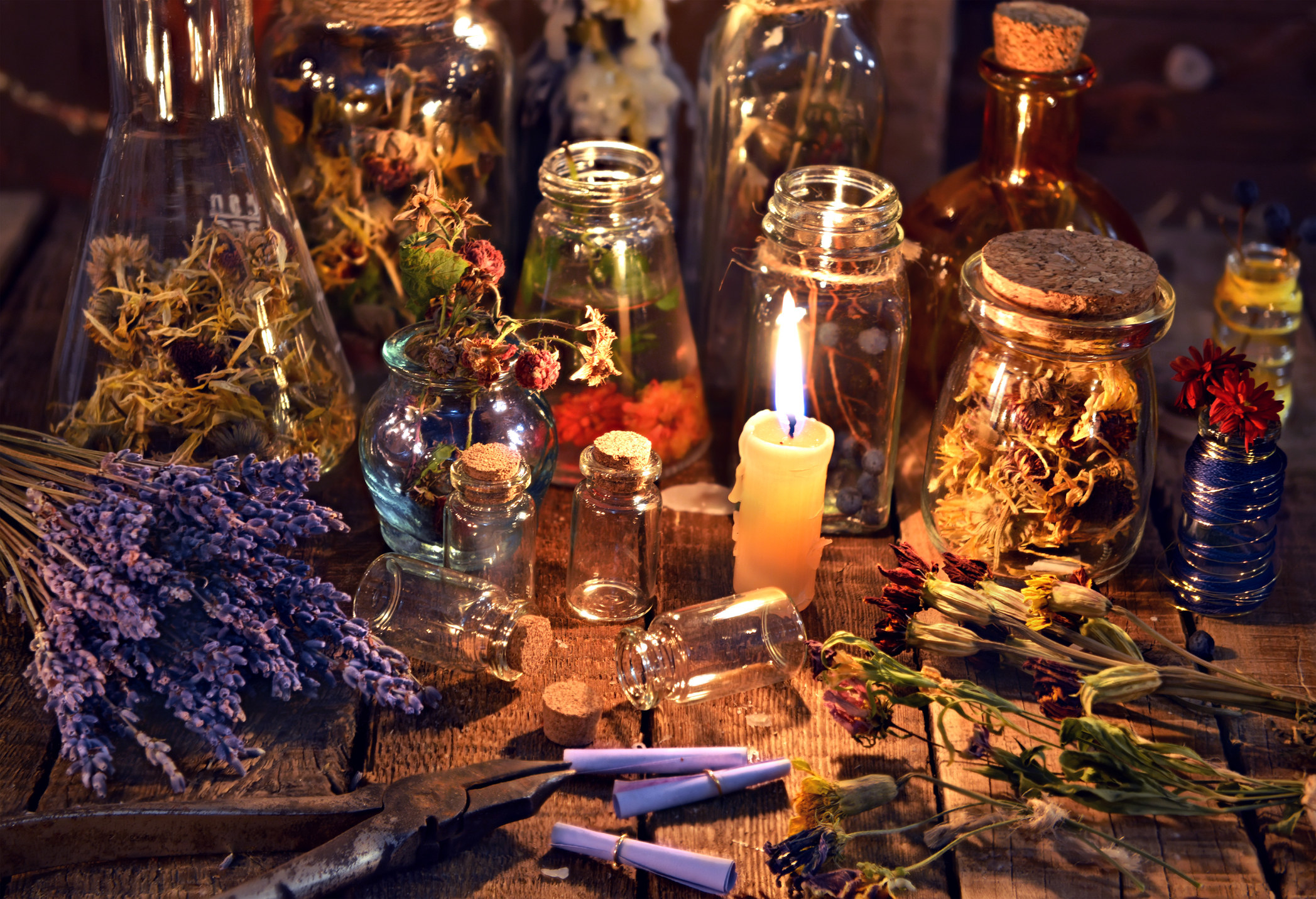 A spell table with herbs and oils