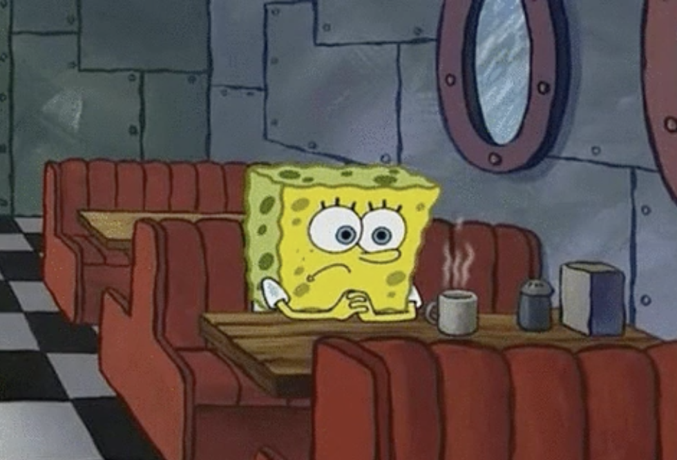 SpongeBob sitting alone in a diner