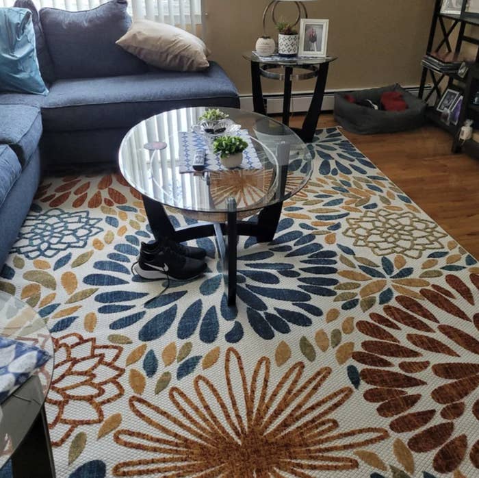 Blue and orange rectangular area rug in a reviewer&#x27;s home