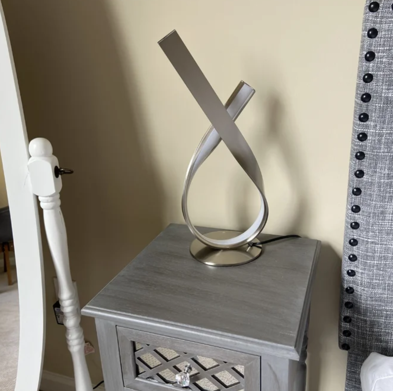 silver lamp on gray table