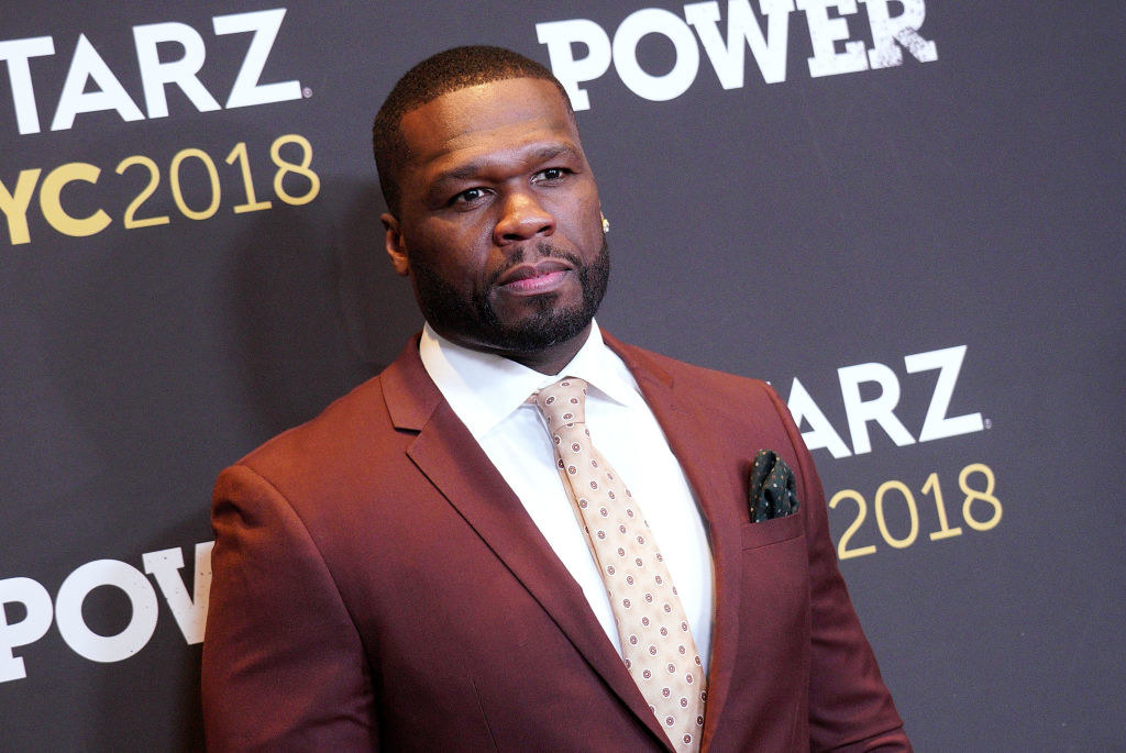 50 Cent at an event in a suit and tie