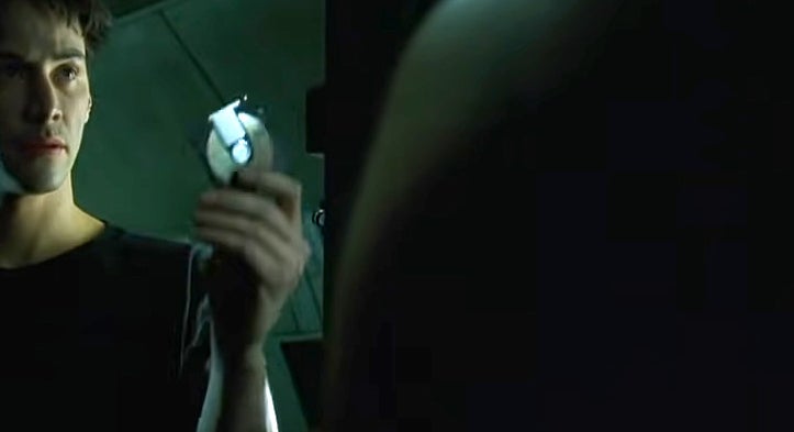 Neo in the Matrix holding a floppy disk