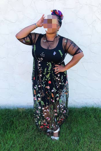 another reviewer posing in the black floral dress