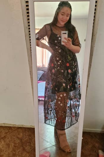 reviewer taking a mirror selfie in the dress
