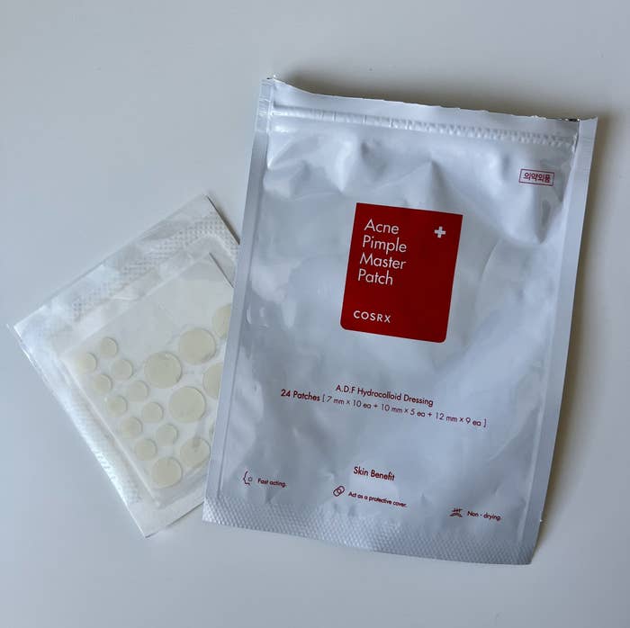 A pack of the pimple patches on a desk