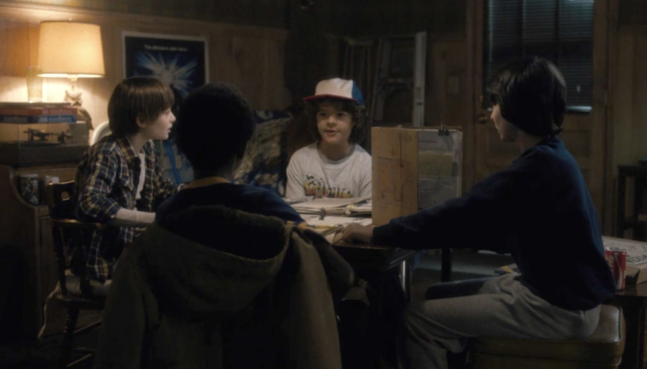 A still from the episode of the kids playing a board game