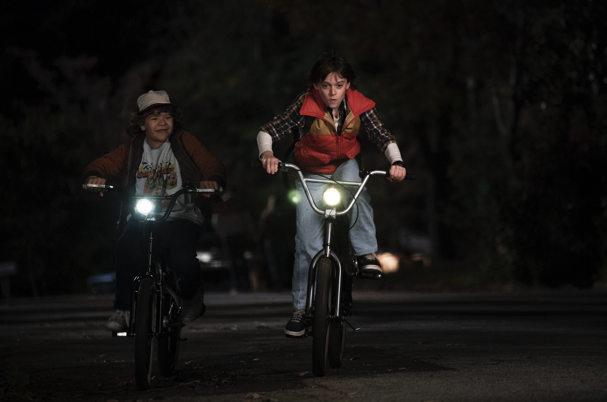 An episode still of two characters on their bikes