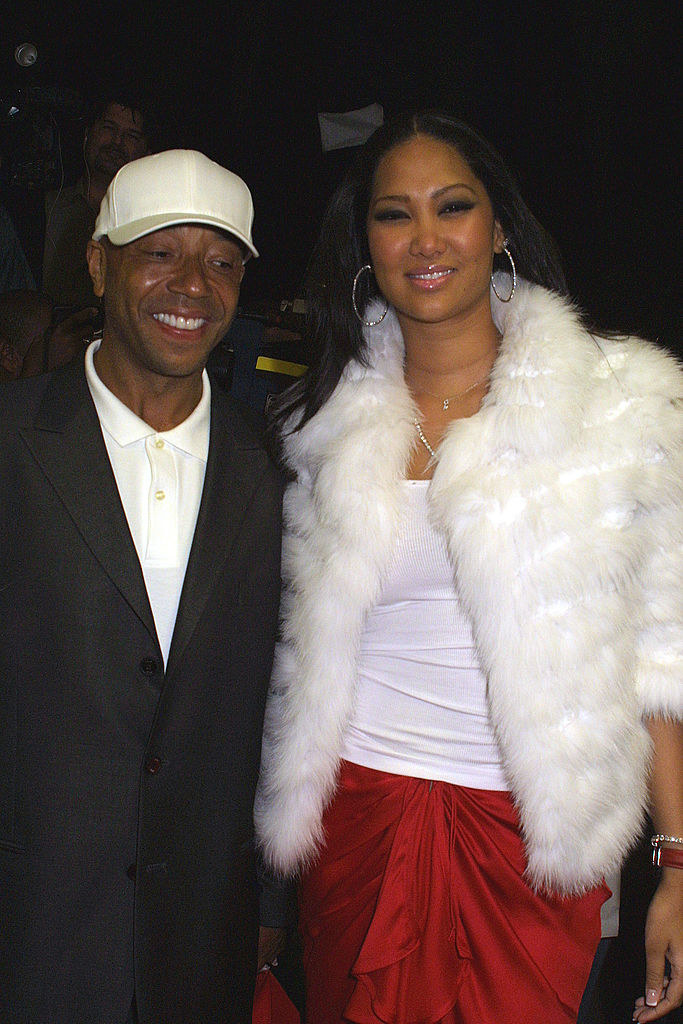 Russell and Kimora, in a fur jacket, smiling