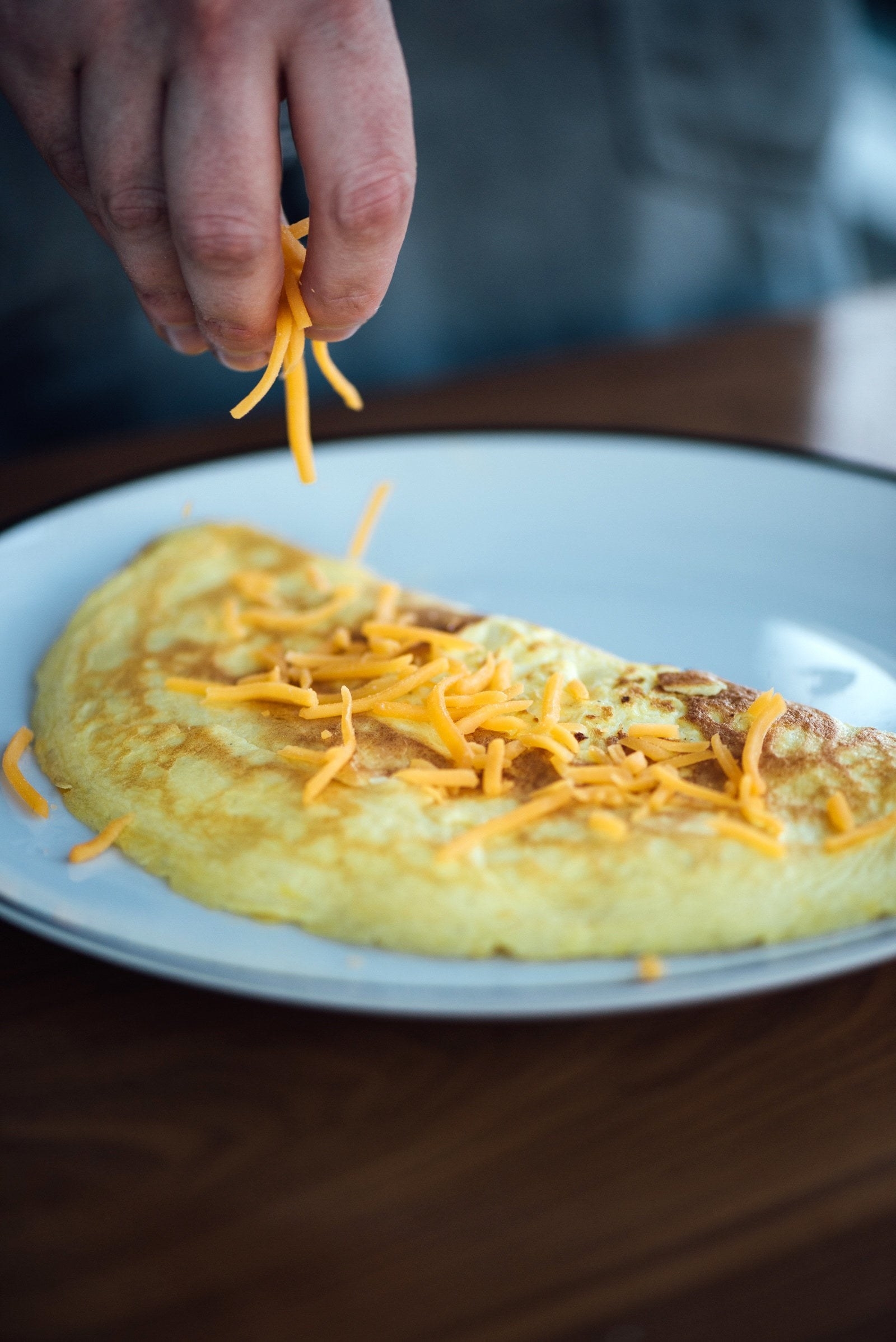 Preparing an omelet with cheese.