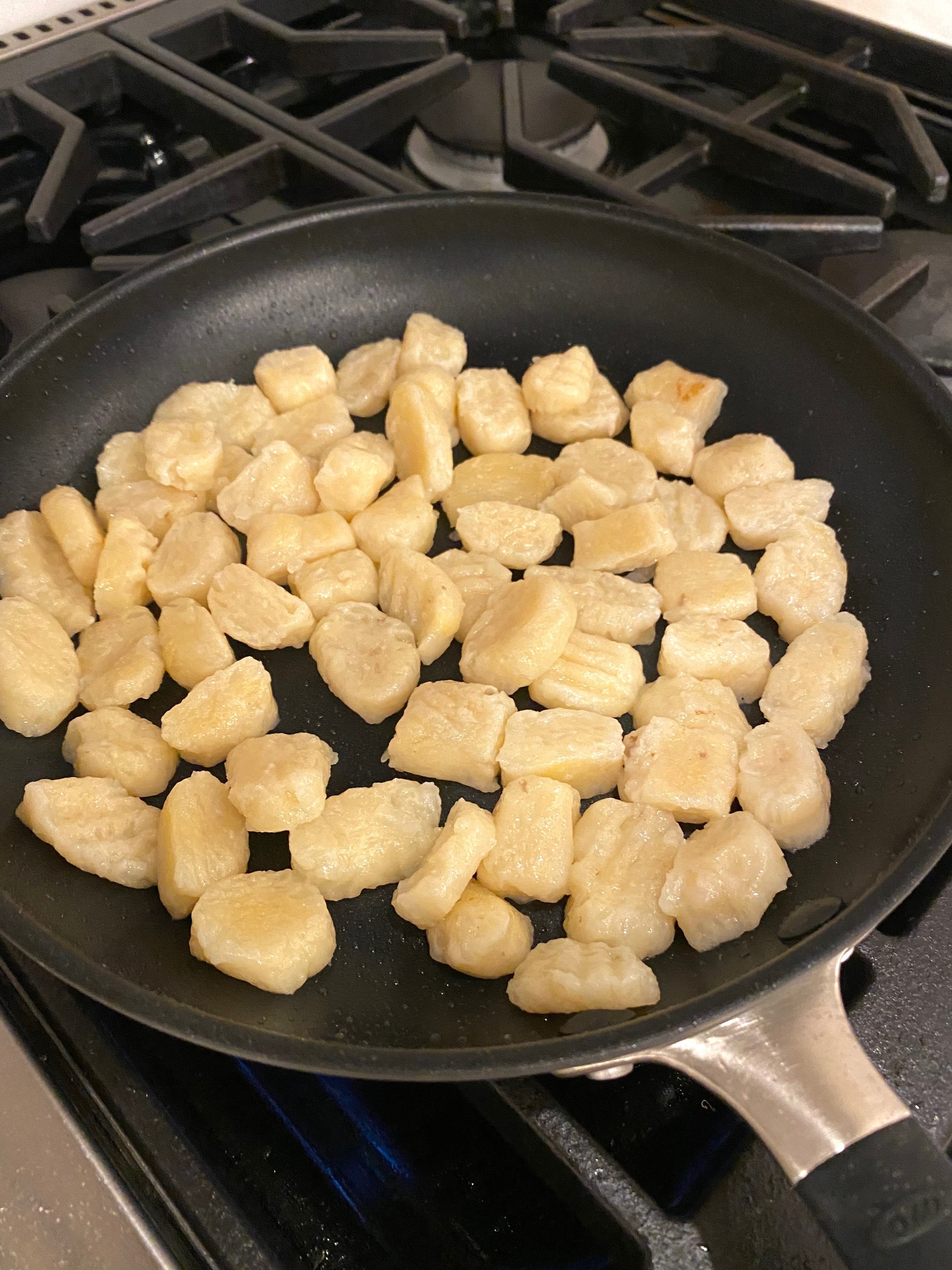 Homemade gnocchi in a skillet.