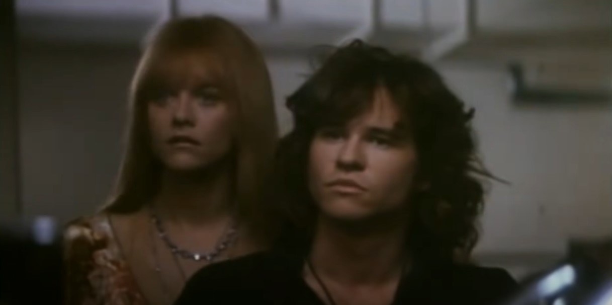 Val Kilmer as Jim Morrison, looking serious