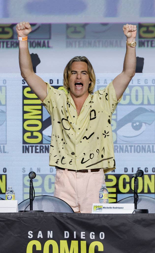 Chris Pine on a panel at Comic-Con with long bleached hair