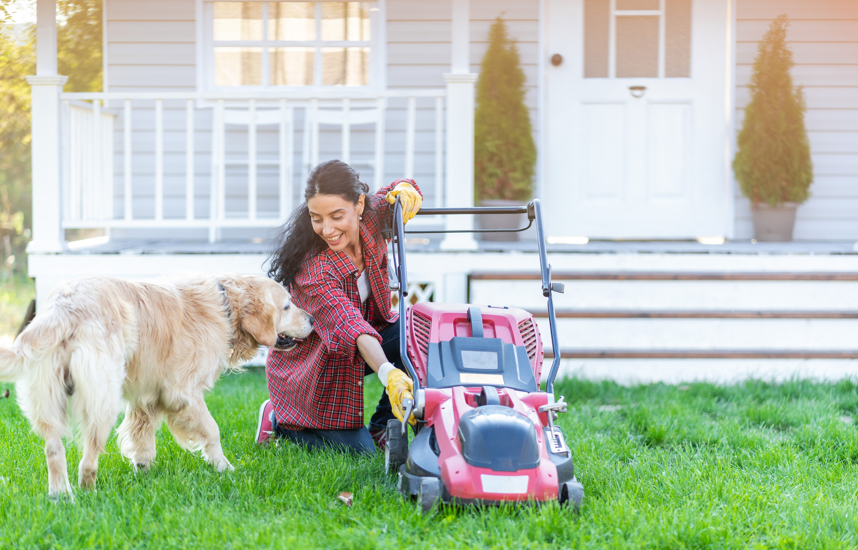 woman starting up her lawnmower