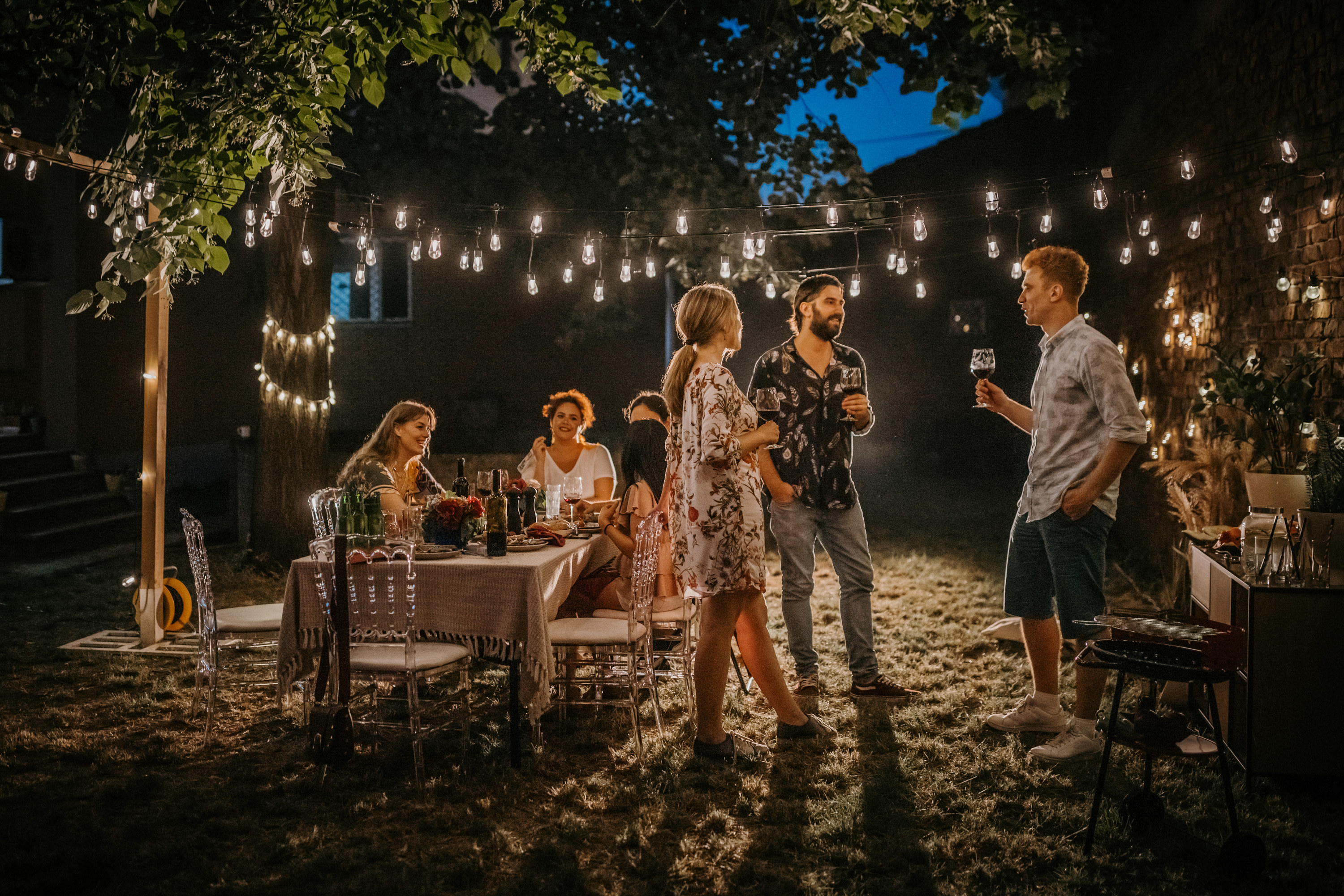 people having a backyard party