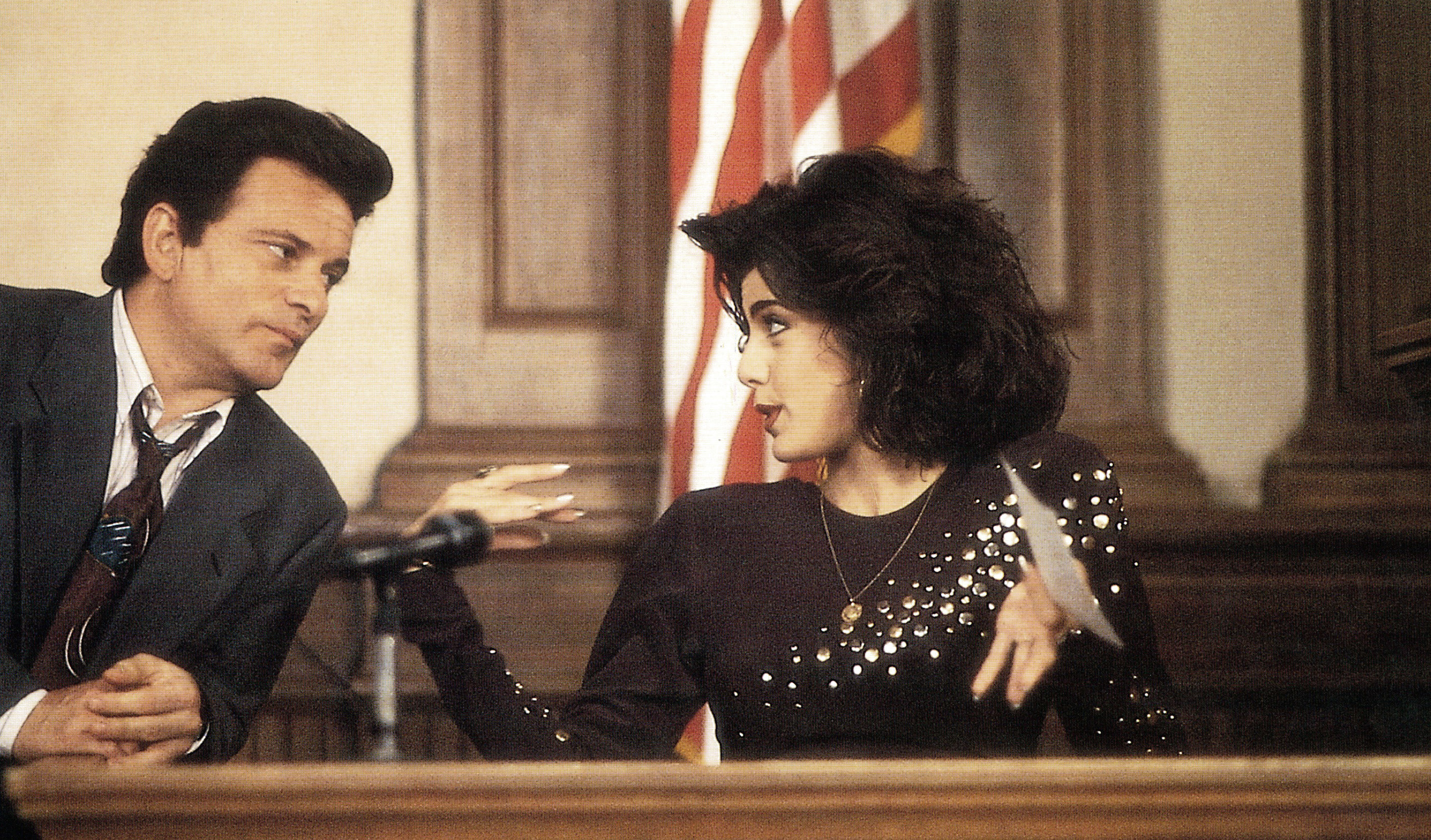a woman being questioned on the stand