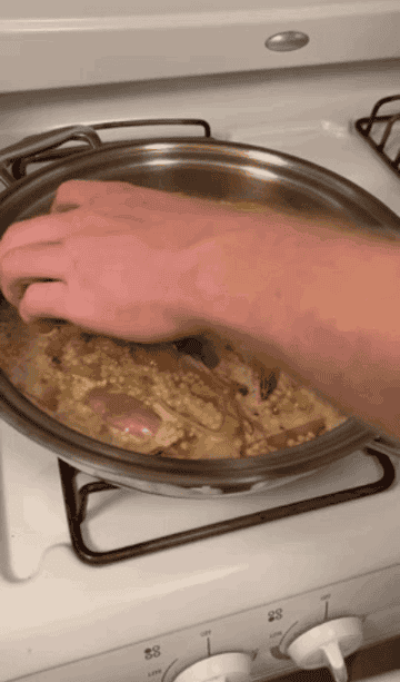 the couscous shallots and chicken in a pan