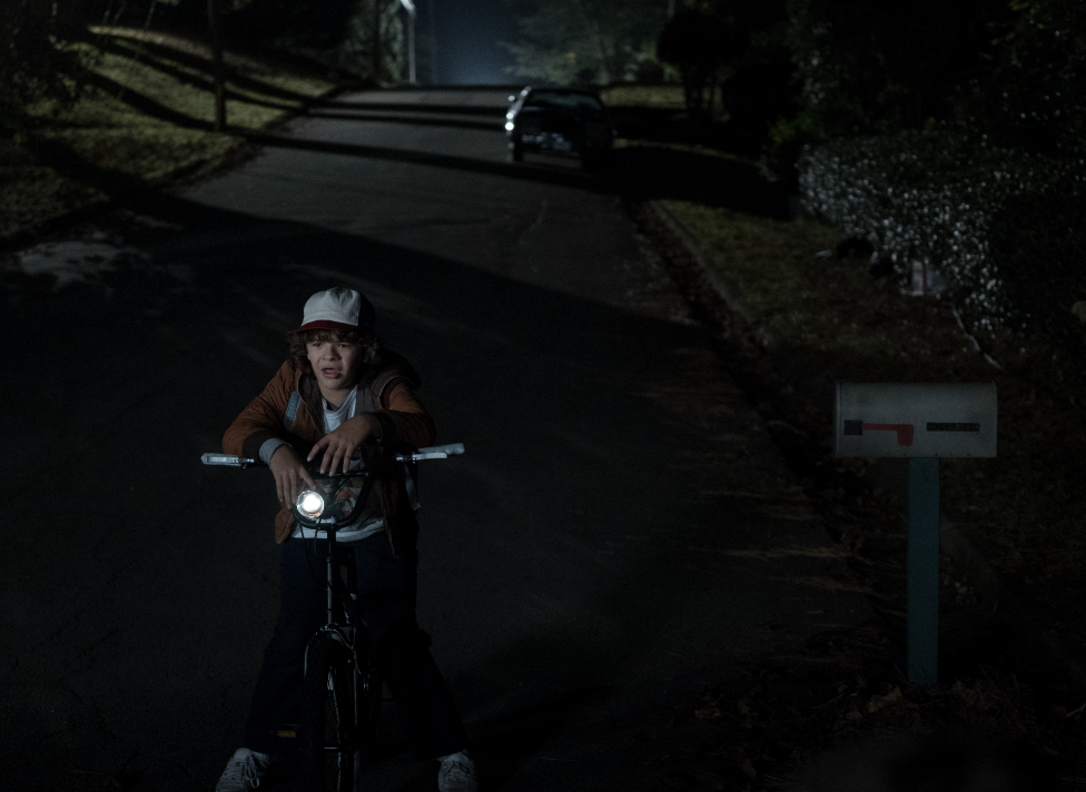 An episode still of Dustin on his bike