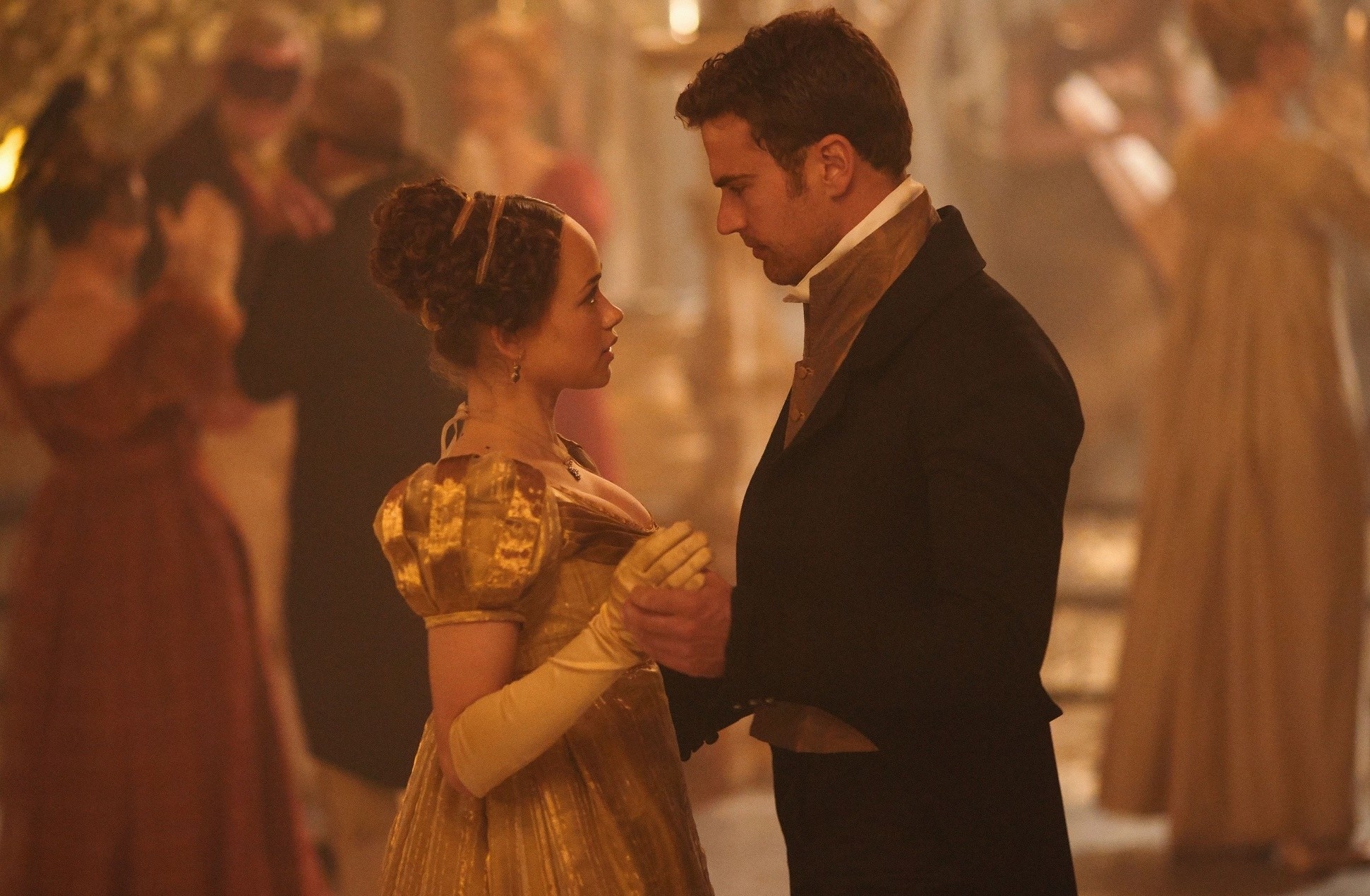 Rose williams as charlotte heywood and Theo James as Sidney Parker dancing together at a ball