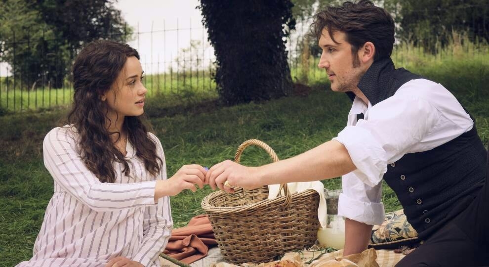 Charlotte and Colbourne characters from sanditon on a picnic and their hands are touching