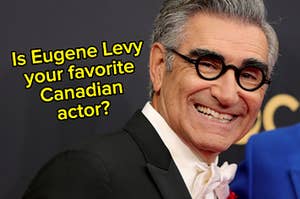 Eugene Levy wears a dark colored suit