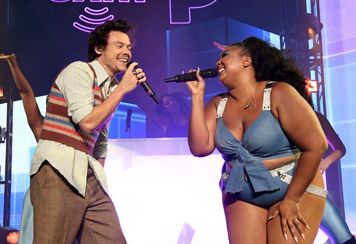 Harry and Lizzo performing on stage