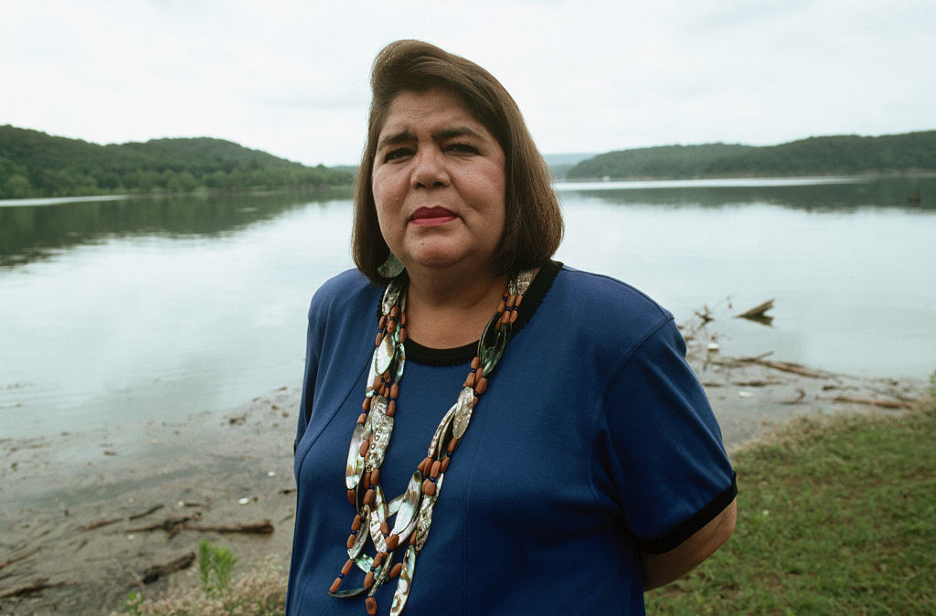 Wilma Mankiller standing by a lake