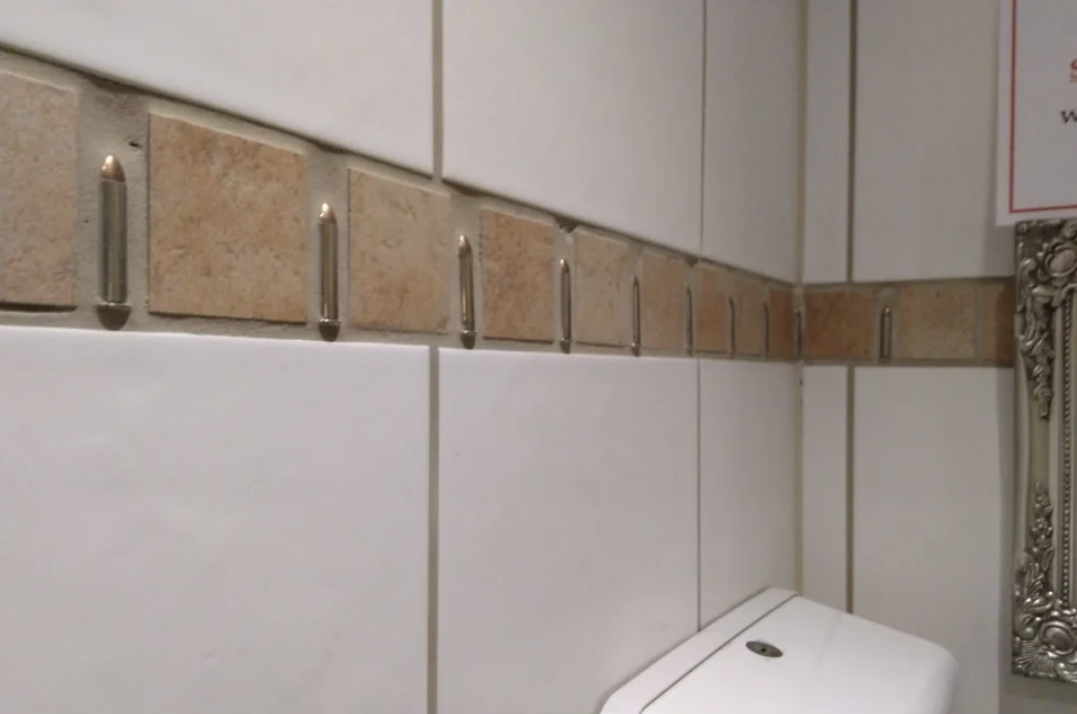 bullets in bathroom tile