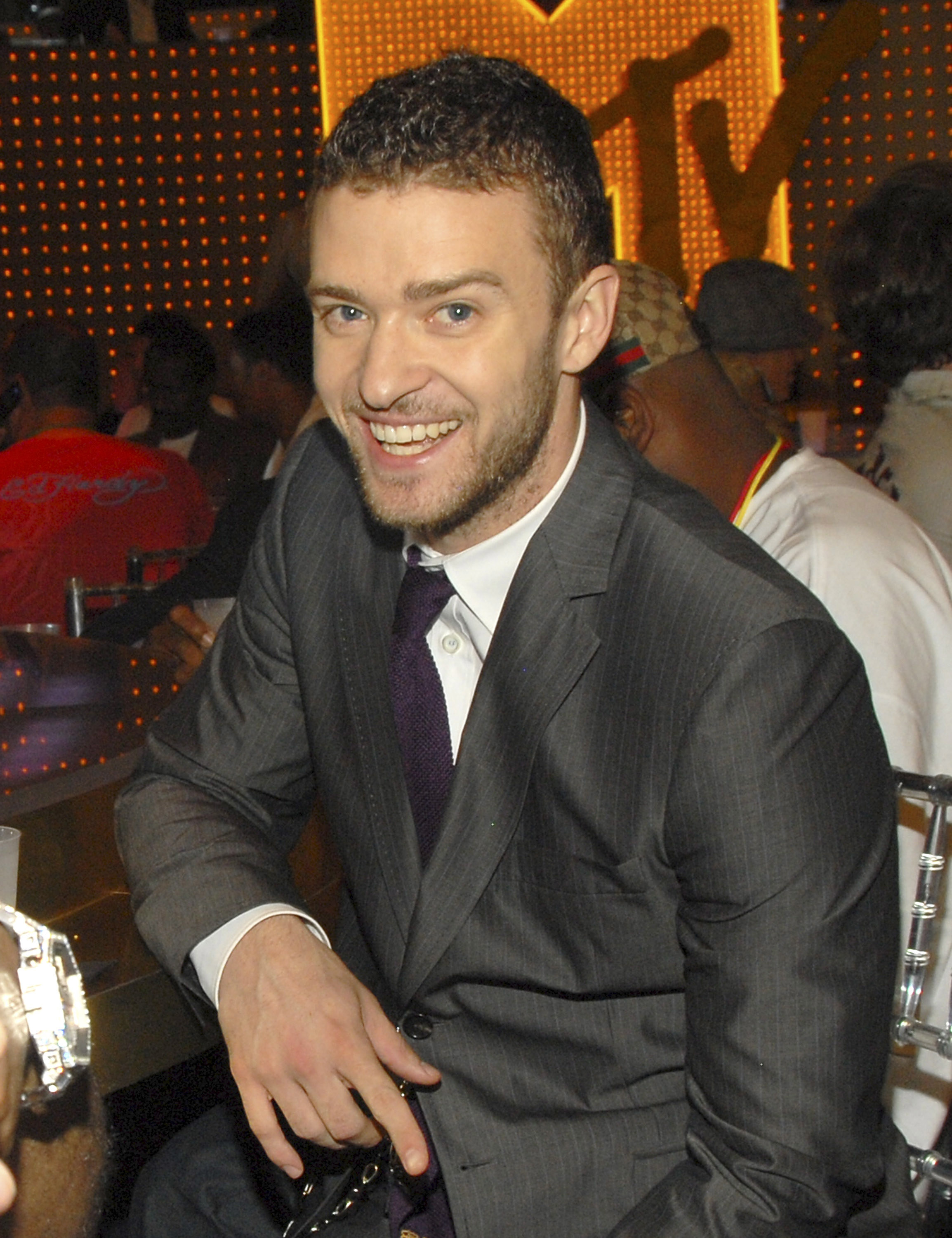 justin smiling at a table